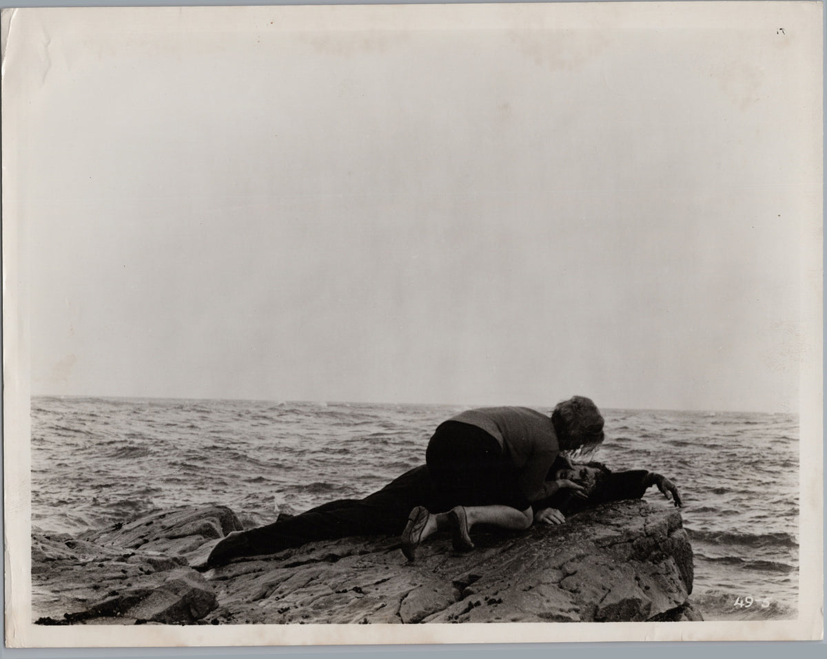 Two Figures on Rocks Beside the Sea — A01021