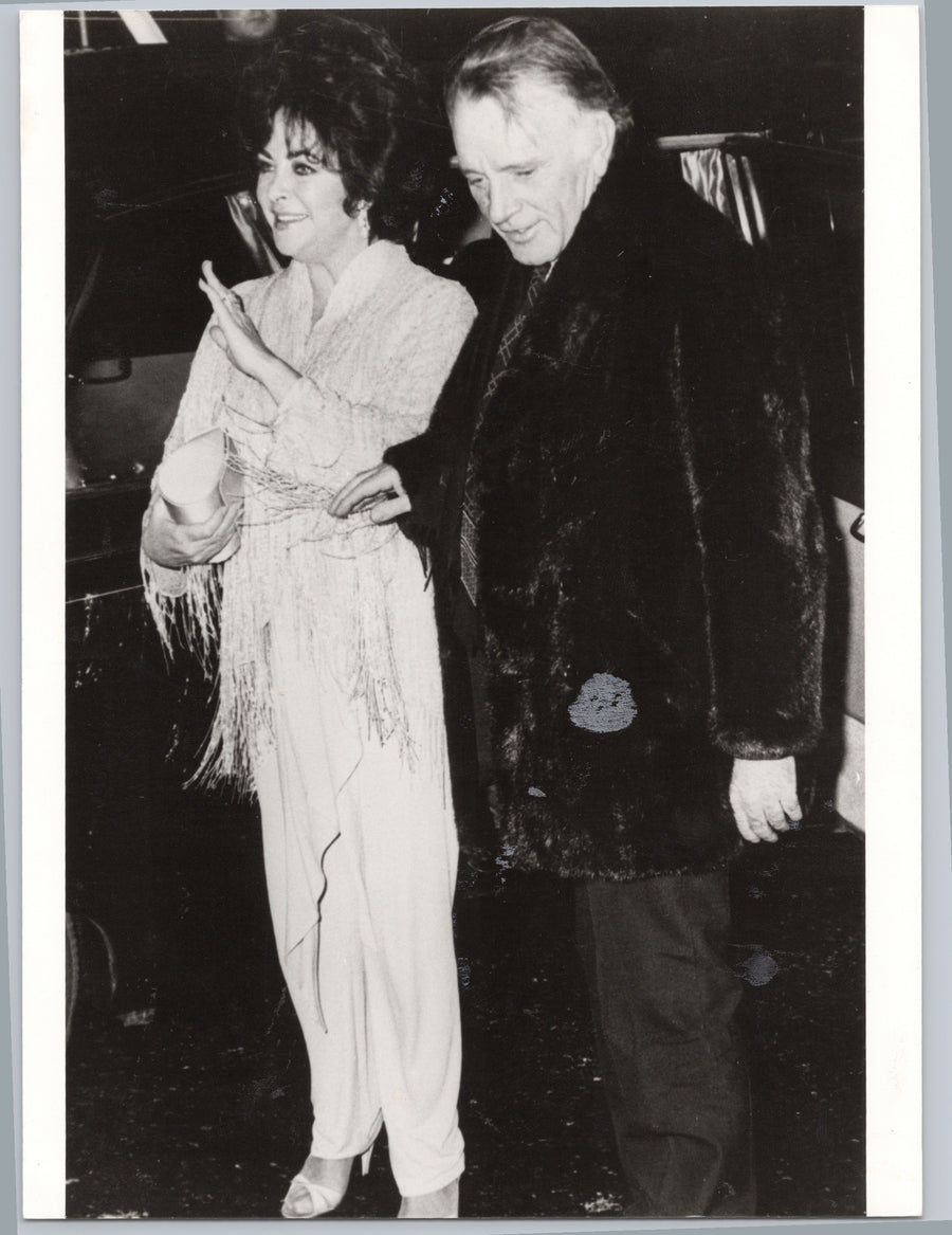 Richard Burton with a Companion at an Evening Event