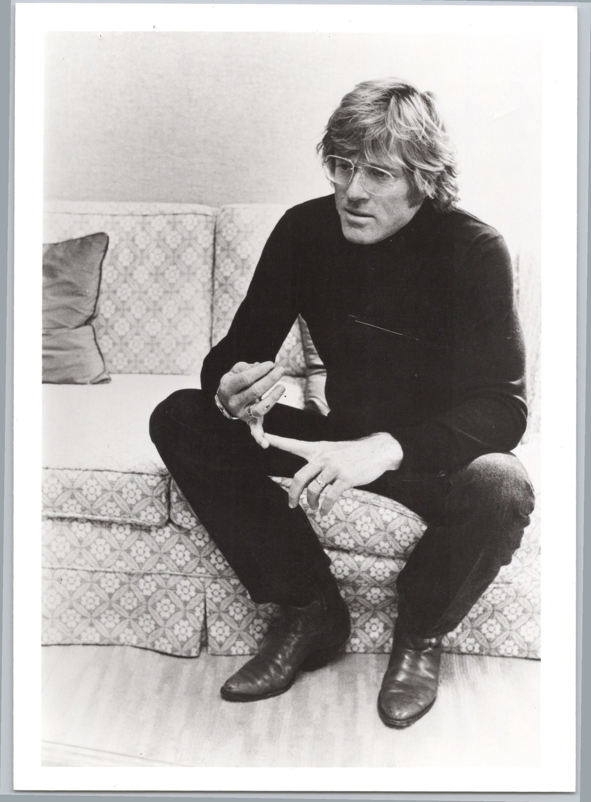 Robert Redford Seated on a Sofa — front