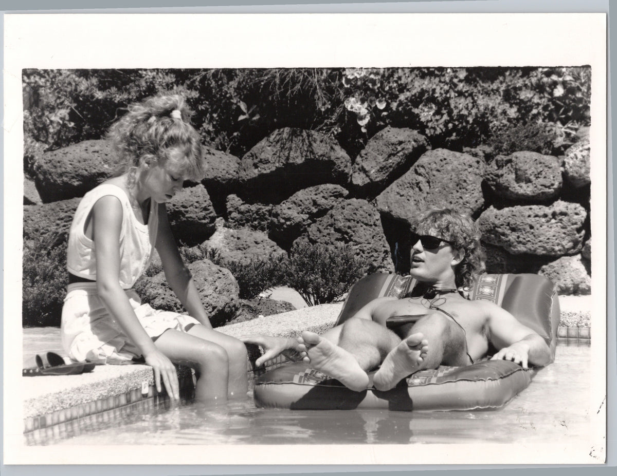 Kylie Minogue and Jason Donovan beside a Pool — front