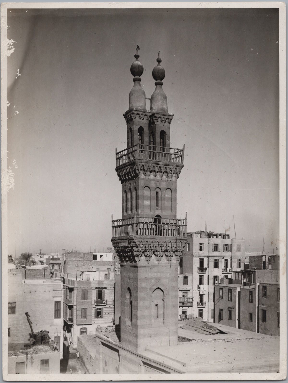 Twin-Finial Minaret Above Cairo Rooftops — front