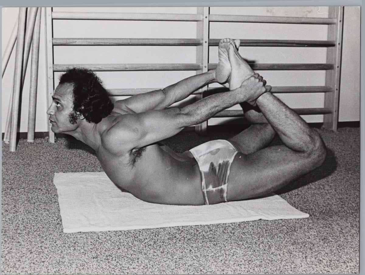 Hyatt Regency Yoga Instructor Demonstrating Bow Pose — front