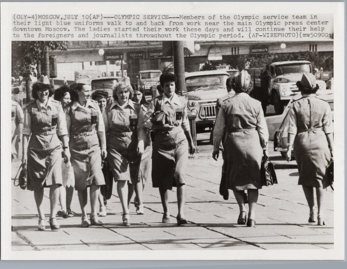 Olympic Service Staff Walking in Moscow — front