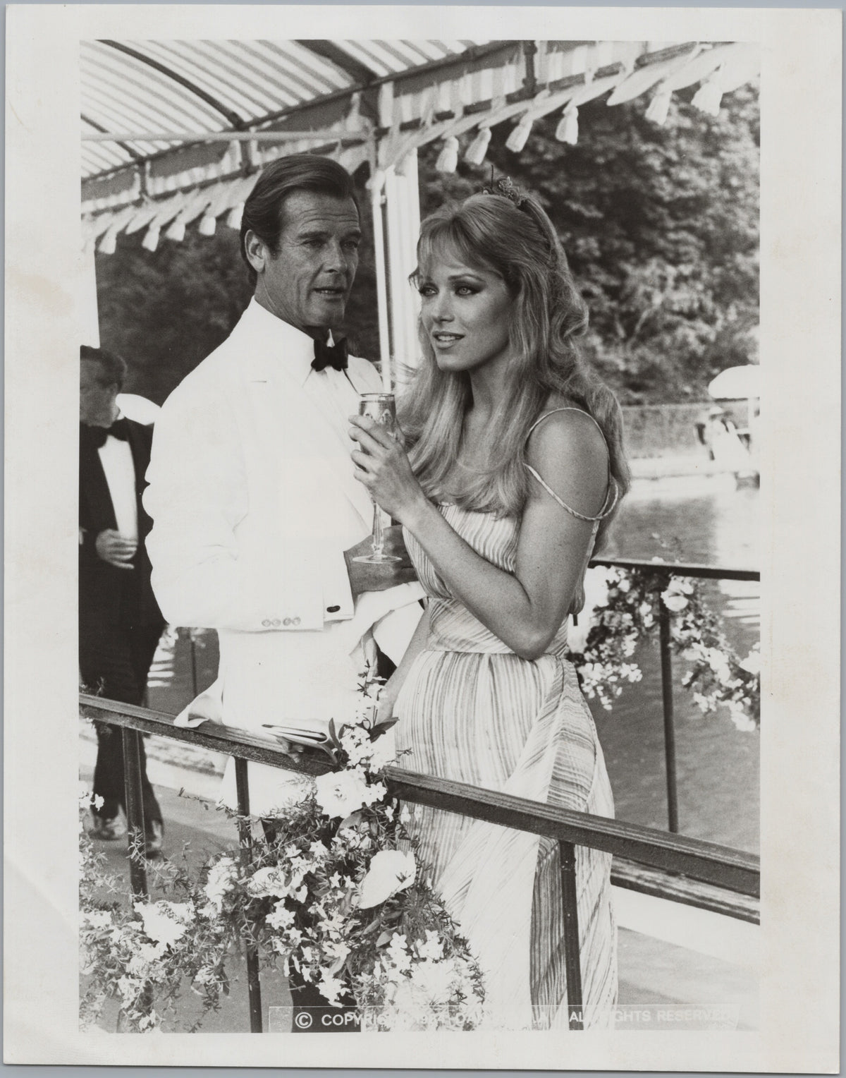 Tanya Roberts and Roger Moore — Formal Publicity Scene — front