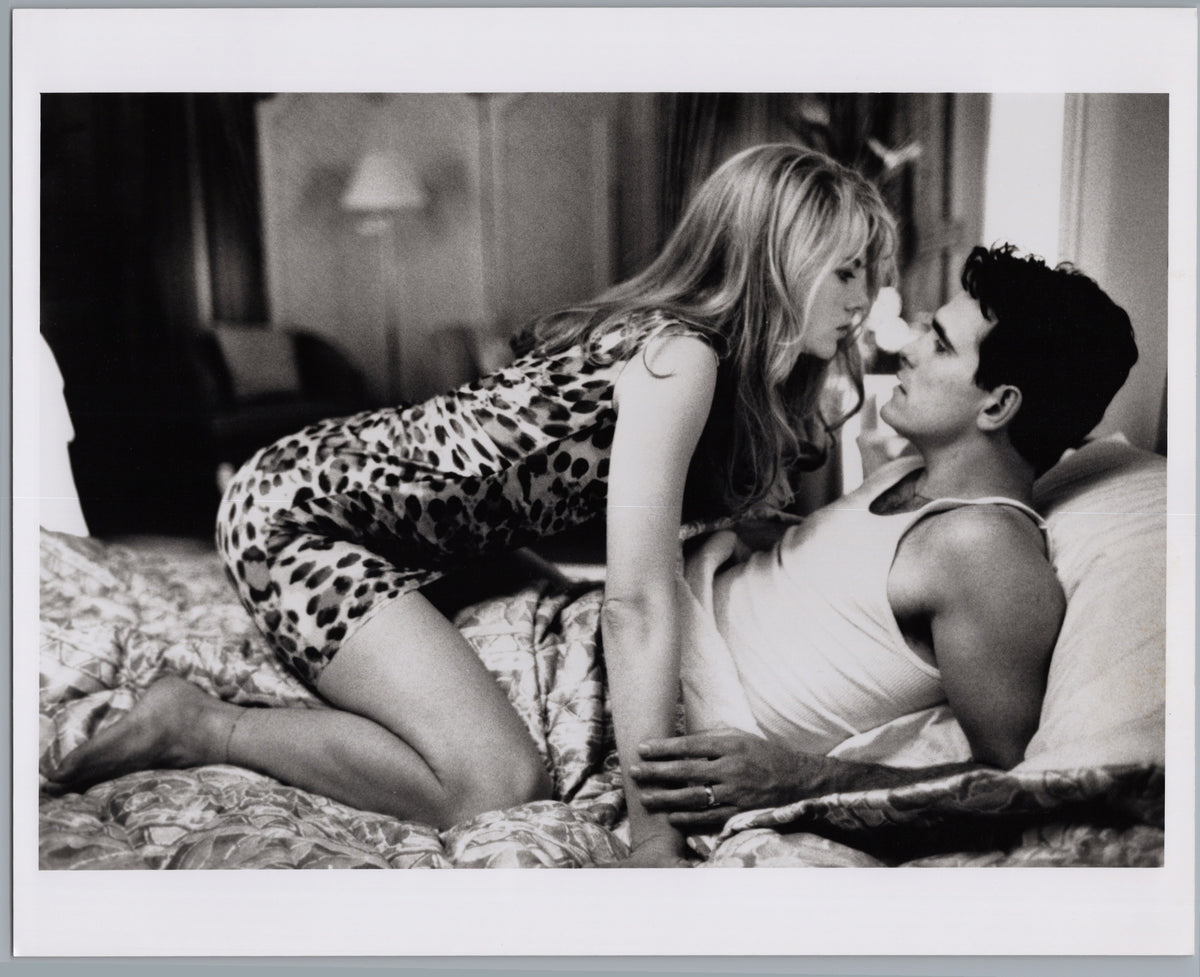 Couple Seated on a Bed — Intimate Film Scene — front