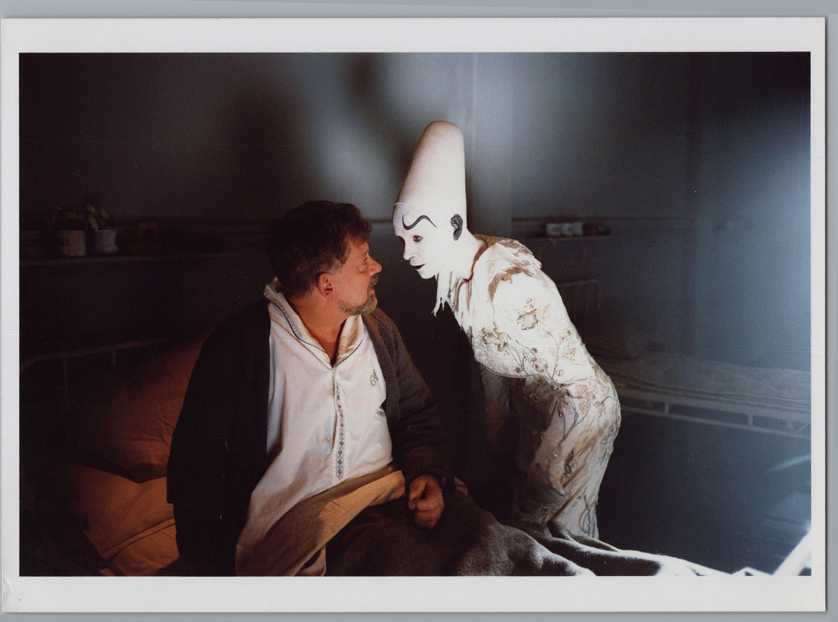 Man Facing a White-Costumed Figure — Colour Scene — front