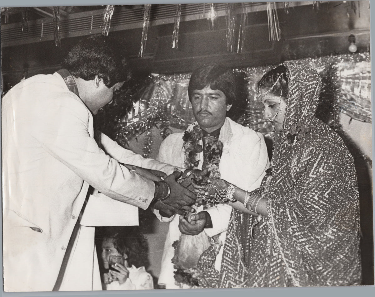 Ceremonial Presentation with a Garlanded Couple — A01010