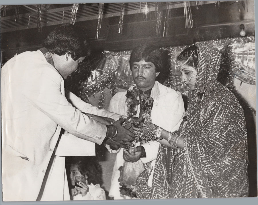 Ceremonial Presentation with a Garlanded Couple