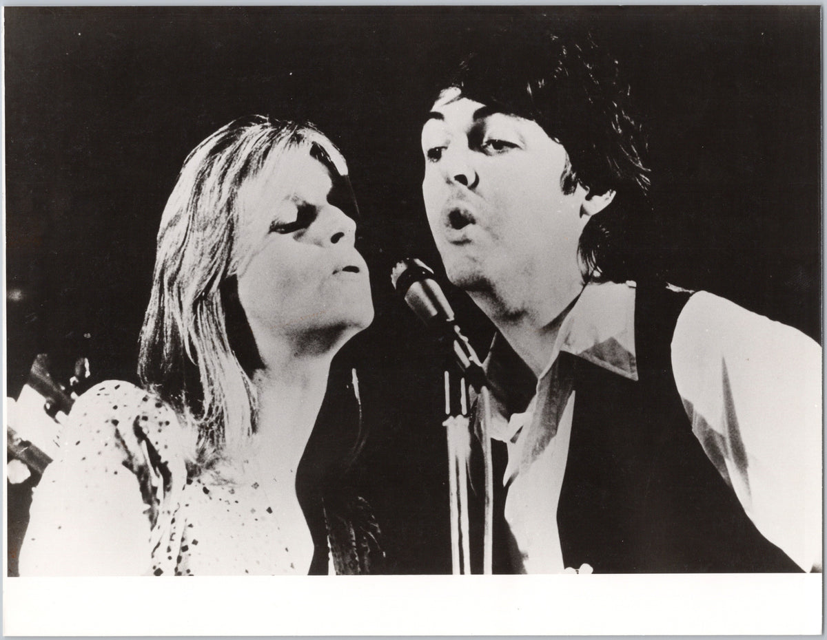 Linda and Paul McCartney Singing at a Microphone — front
