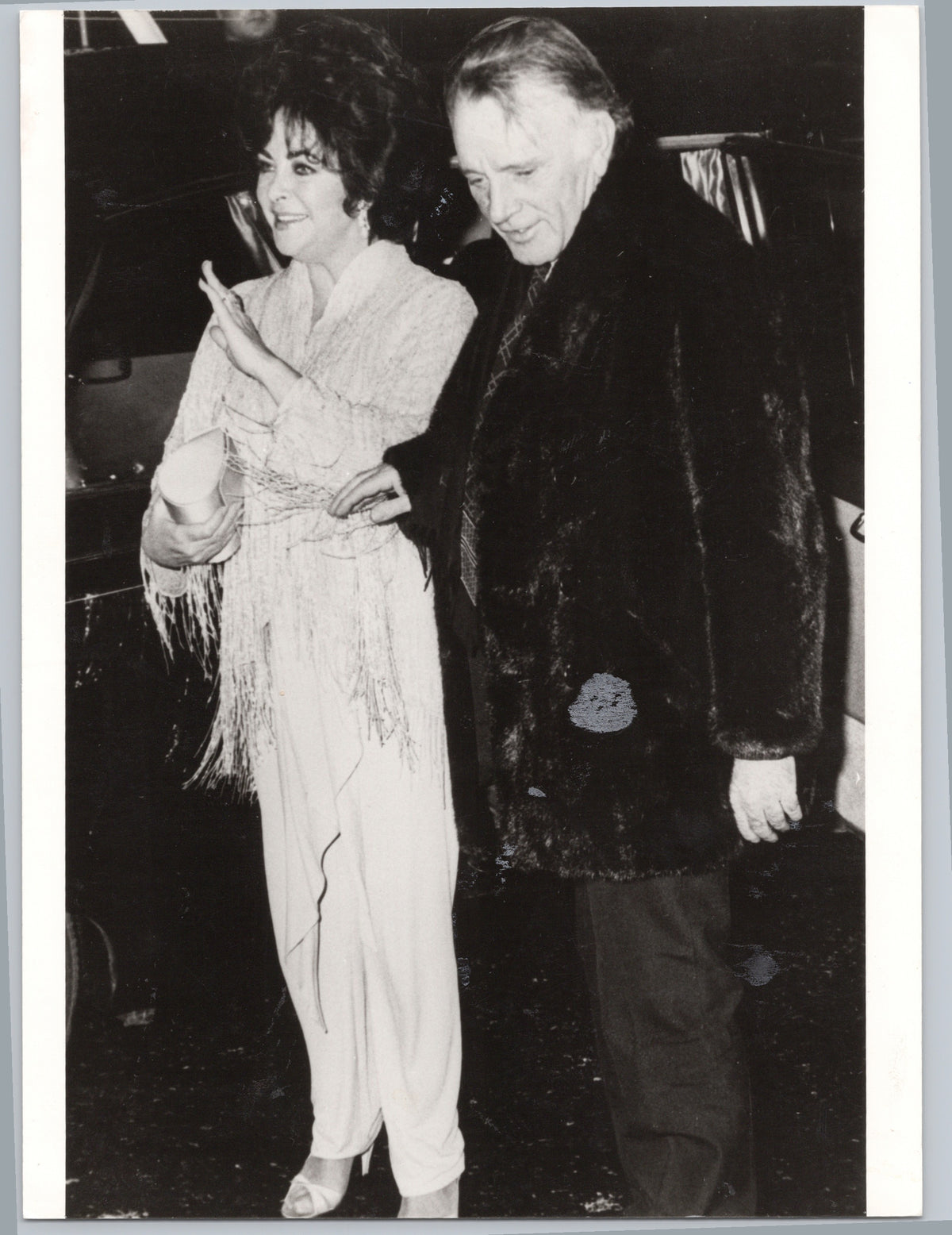Richard Burton with a Companion at an Evening Event — front