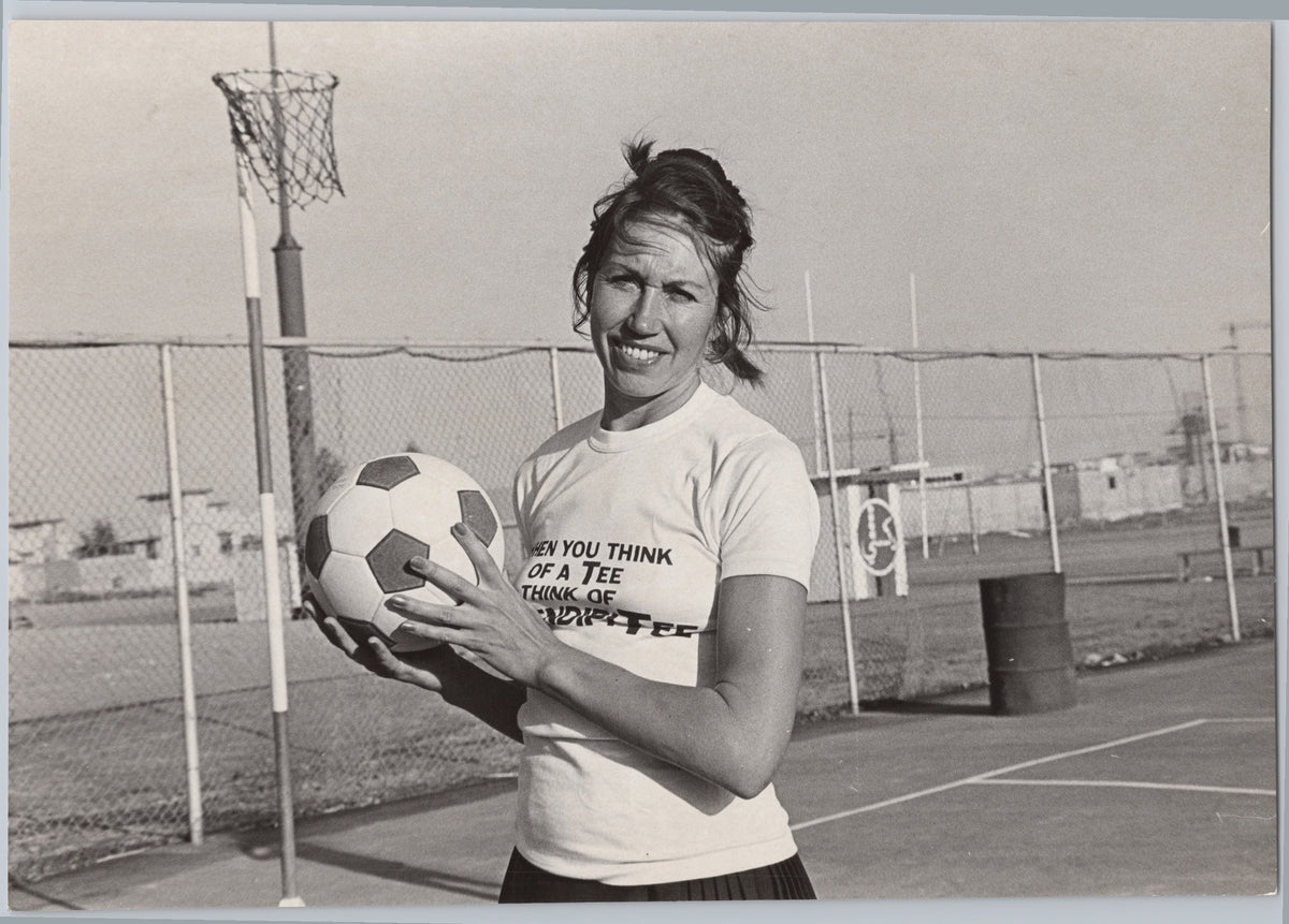 Judi Heath Holding a Football — front