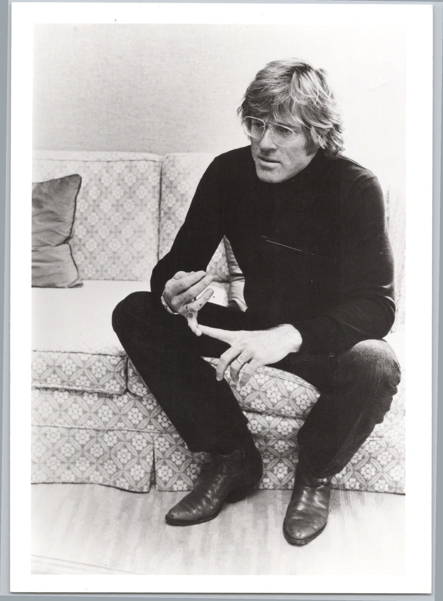Robert Redford Seated on a Sofa
