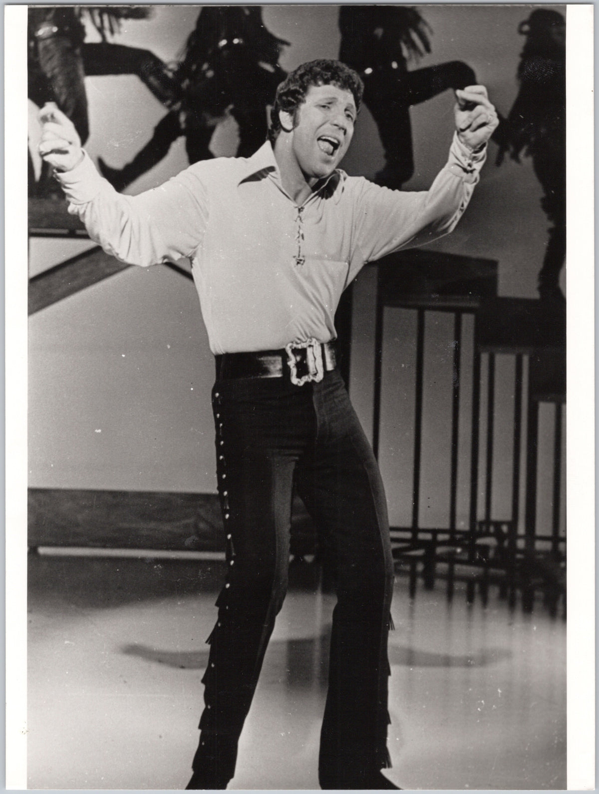 Tom Jones Performing with a Microphone — front