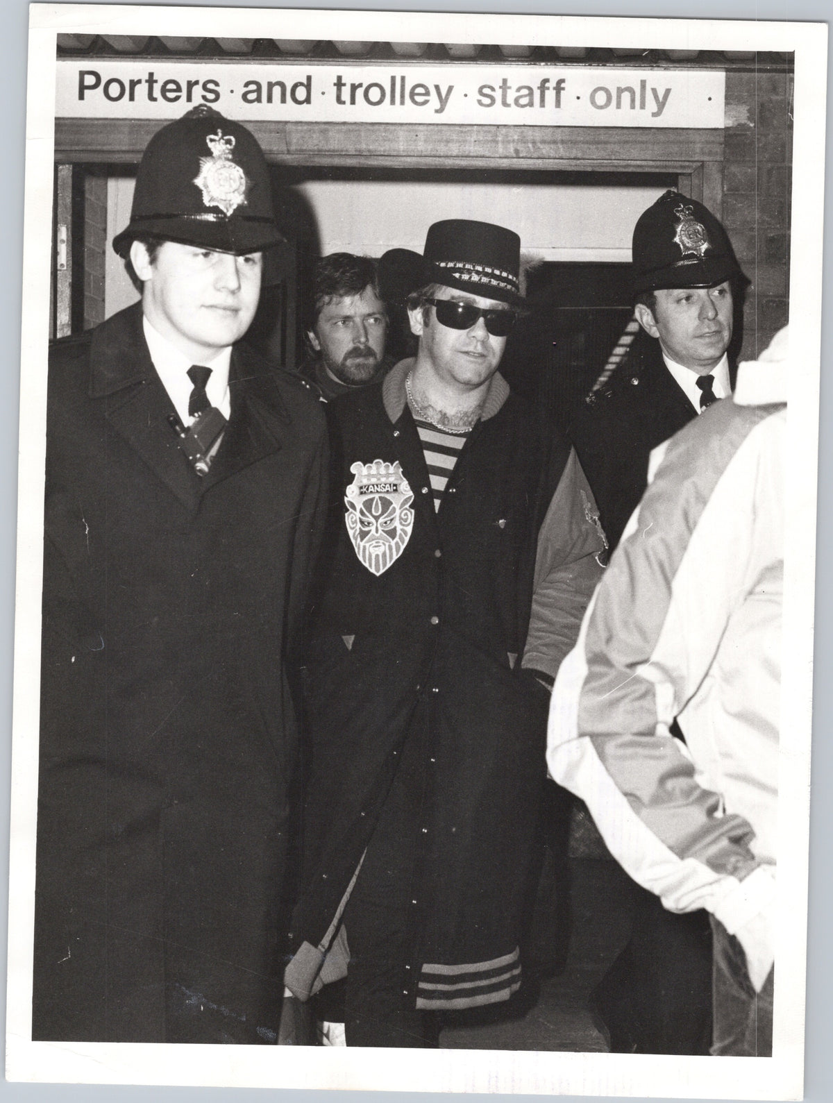 Elton John with a Police Escort at Heathrow — 1980 — front