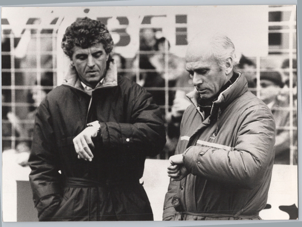 Udo Lattek and Erich Ribbeck Comparing Watches — front