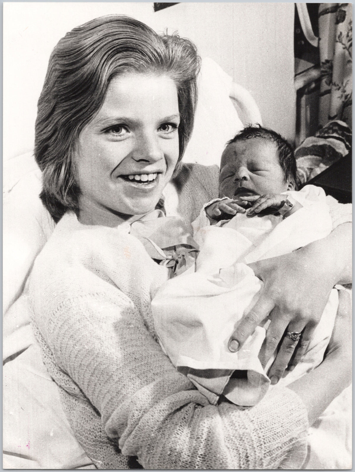 Woman Holding a Baby — Close Portrait — front