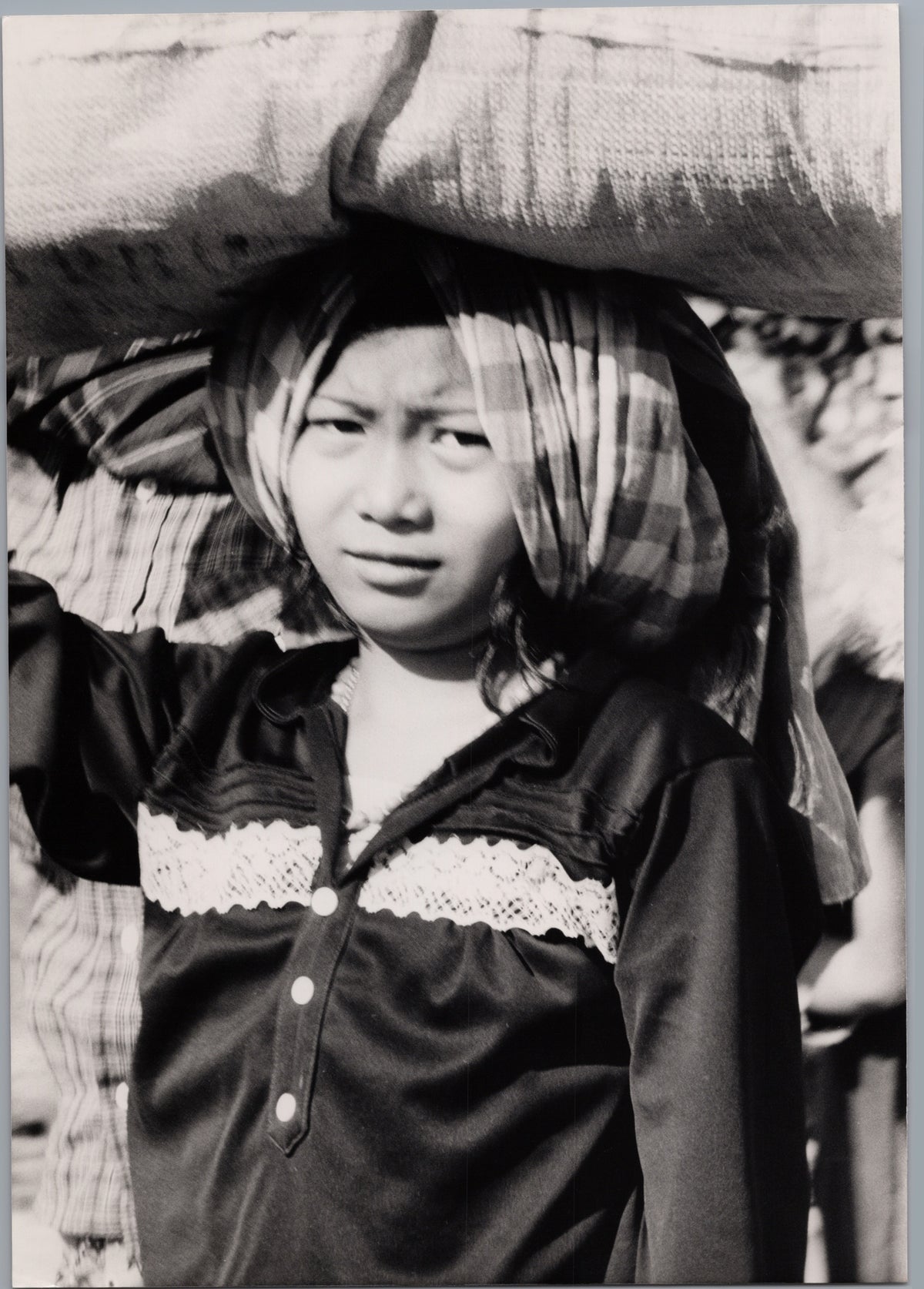 Cambodian Girl Carrying a Sack — front