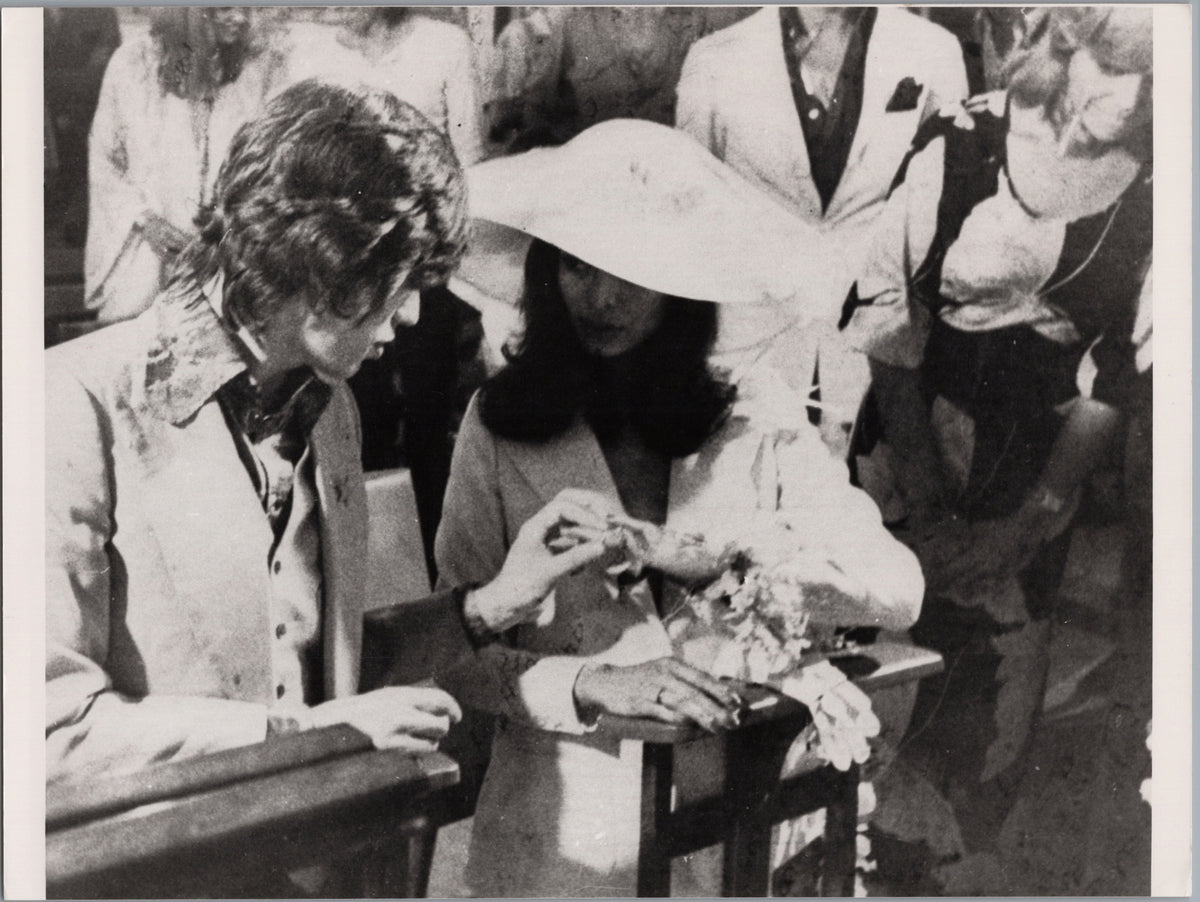 Mick Jagger Places a Ring on Bianca's Finger — front
