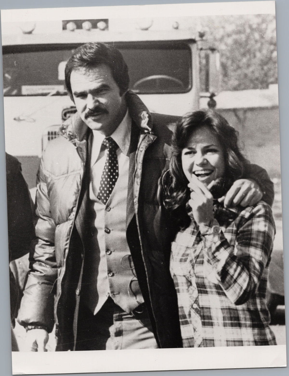 Burt Reynolds and Sally Field Beside a Trailer — front