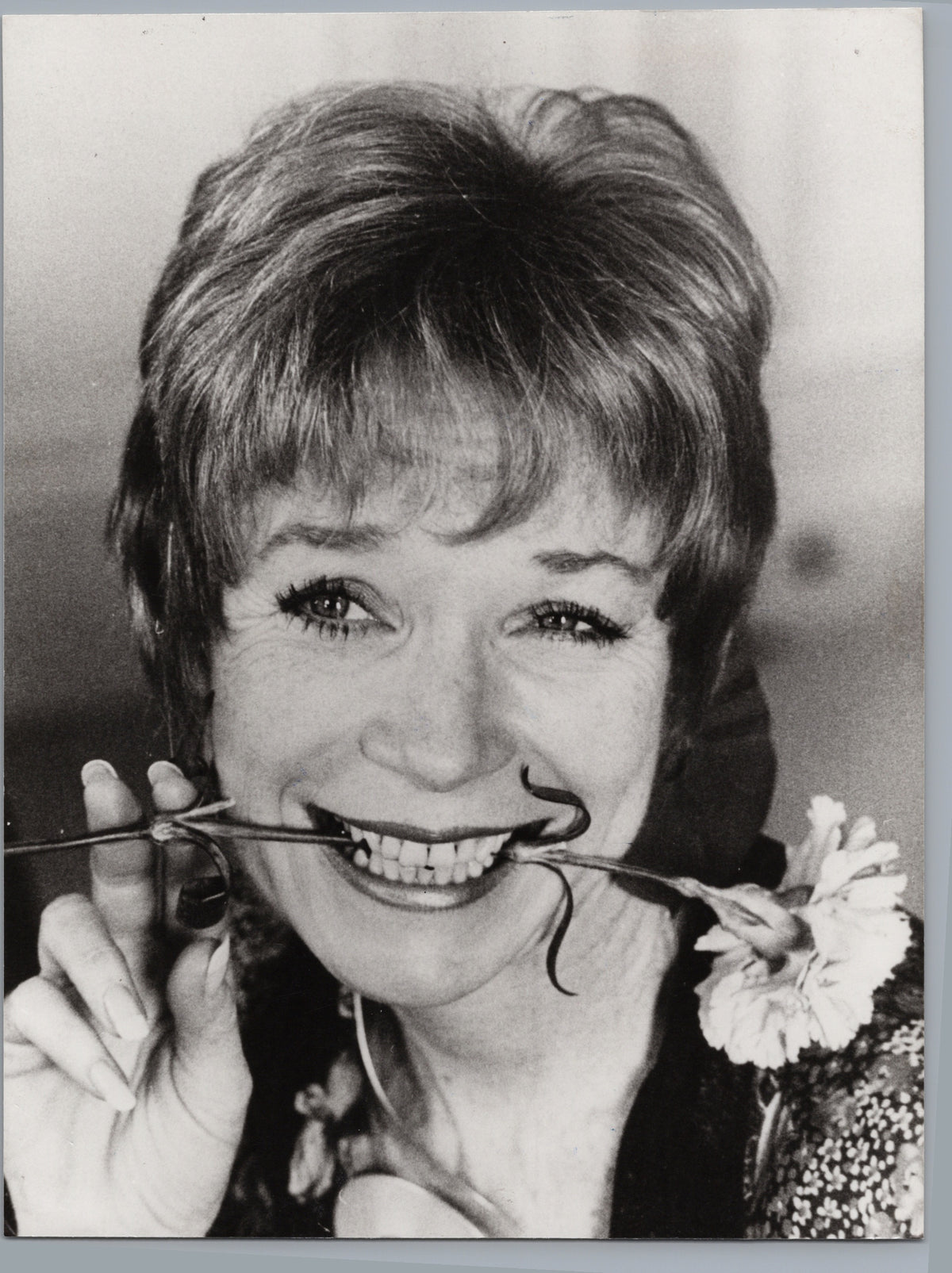 Shirley MacLaine with a Flower — front
