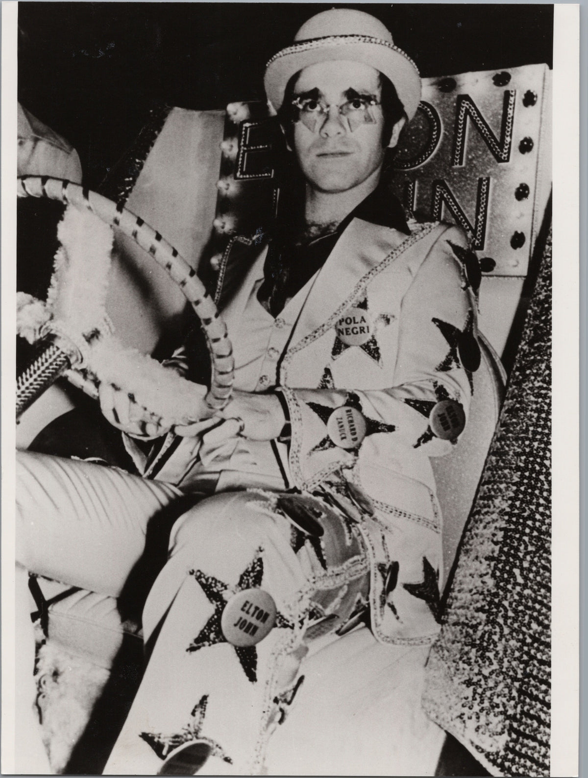 Elton John in a Patterned Suit and Hat — front