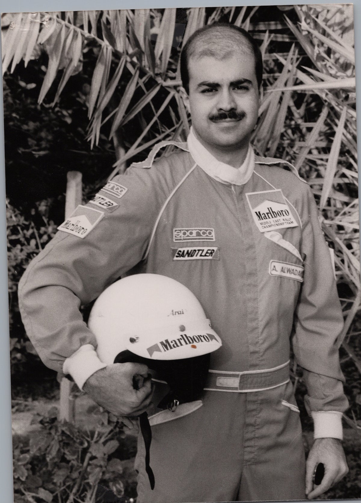 Rally Driver Posing with a Helmet — front