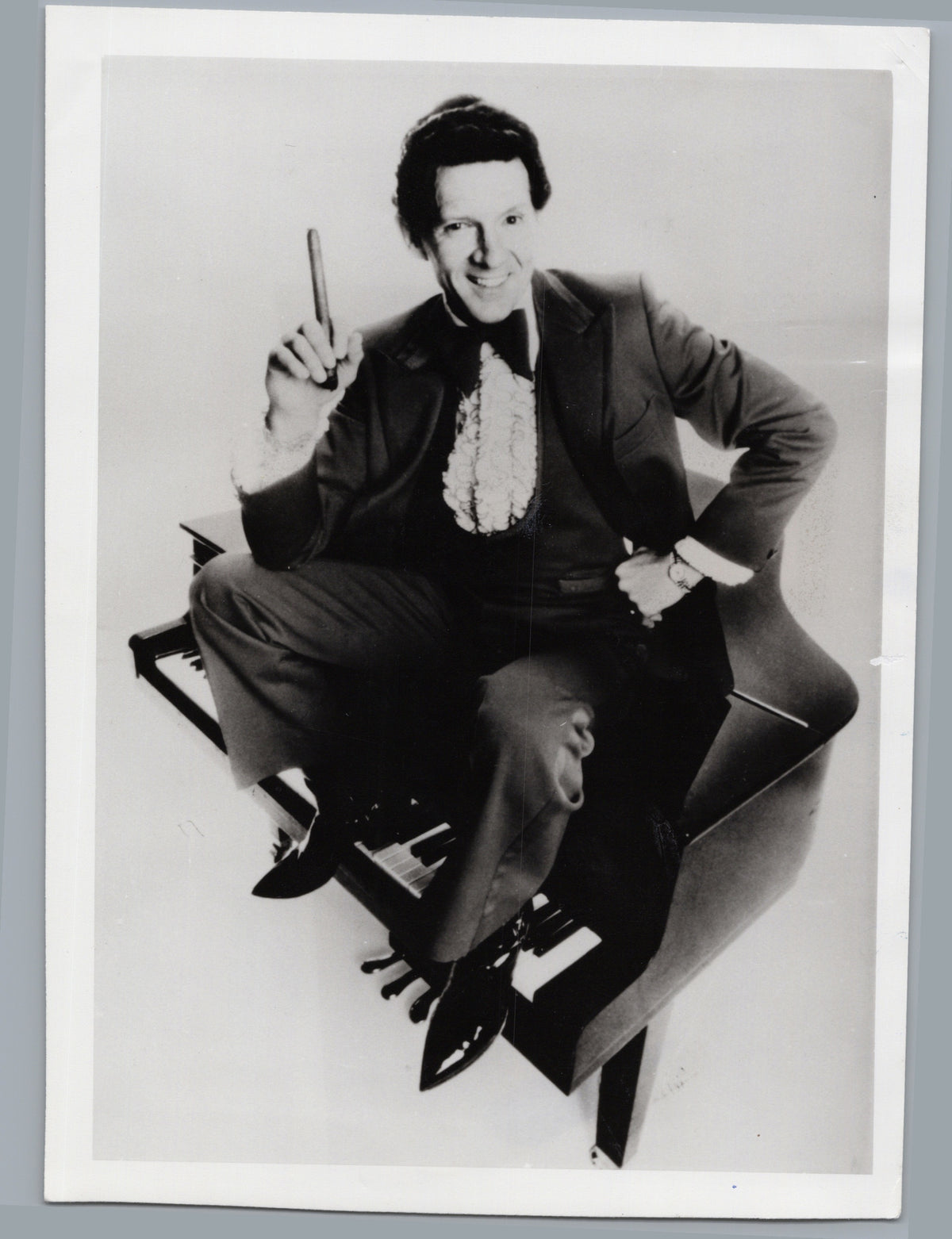 Jerry Lee Lewis Posing on a Piano — front