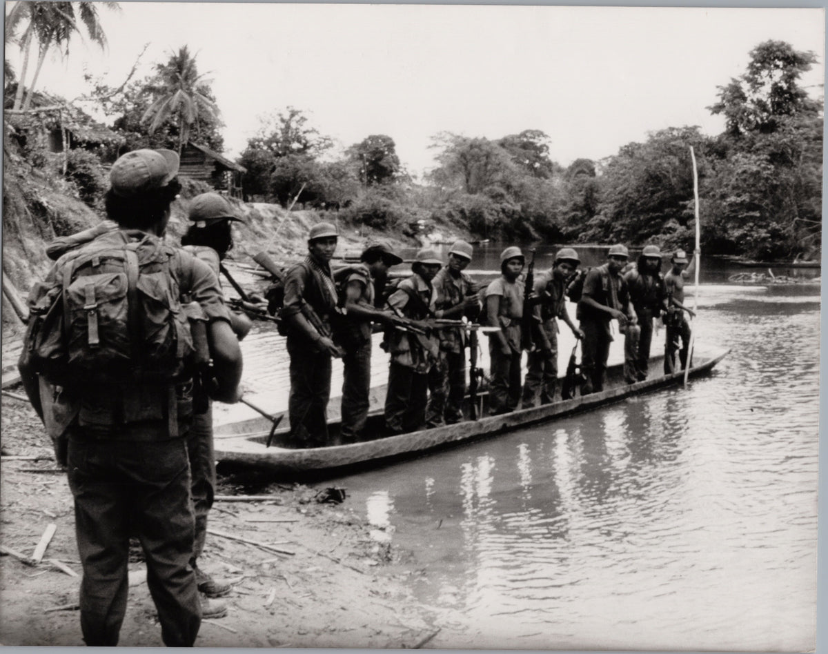 KISAN Guerrillas Receiving a Briefing in a Canoe — front