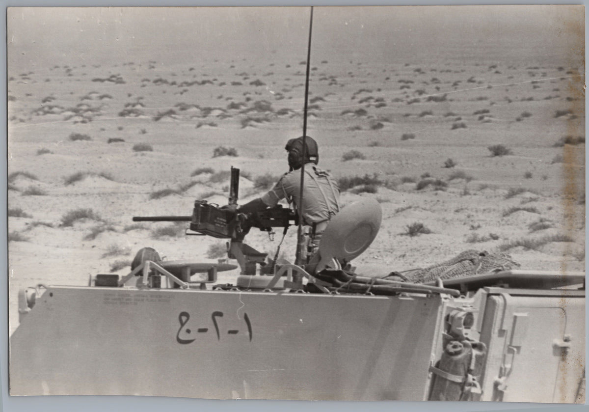 Crew Member Aboard a Small Motorboat — front