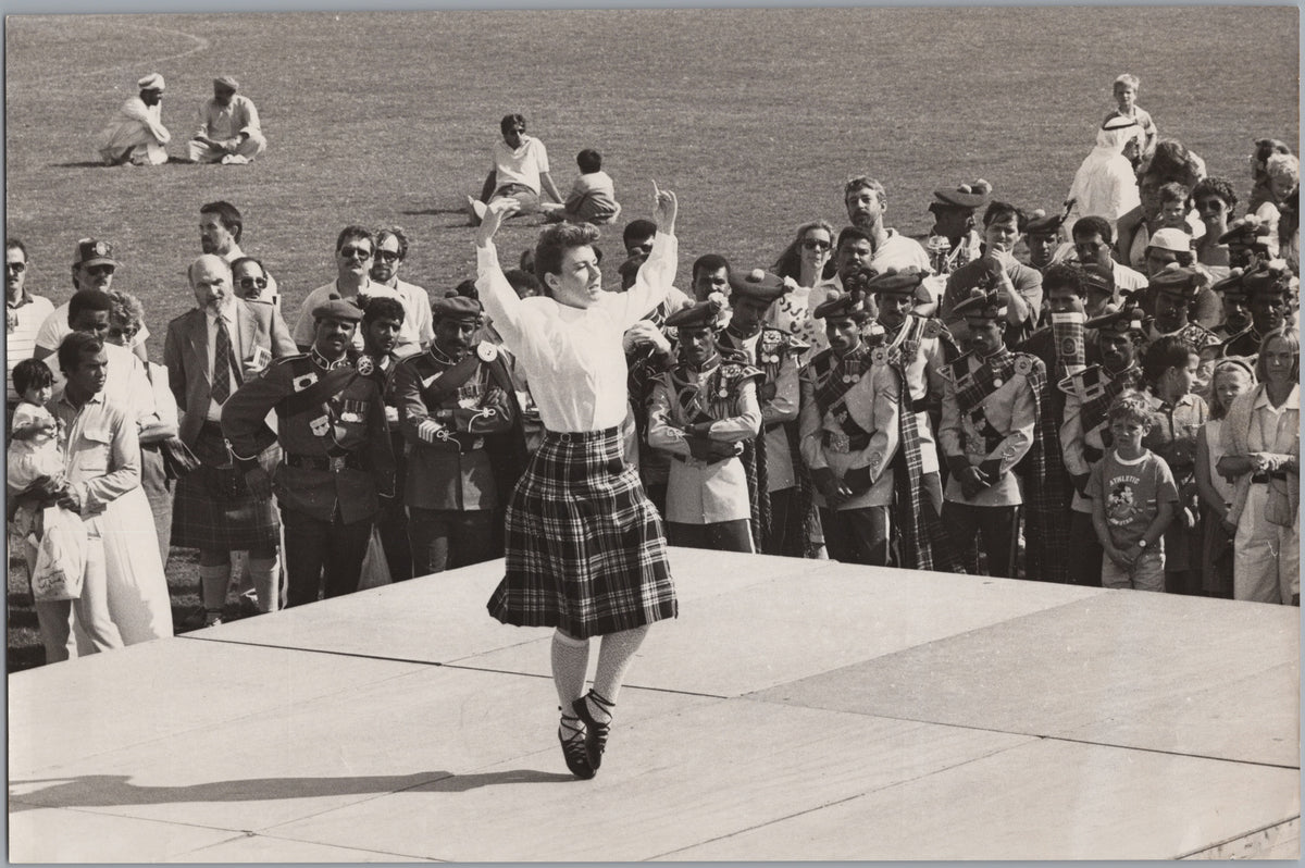 Highland Dancer Performing before a Crowd — front