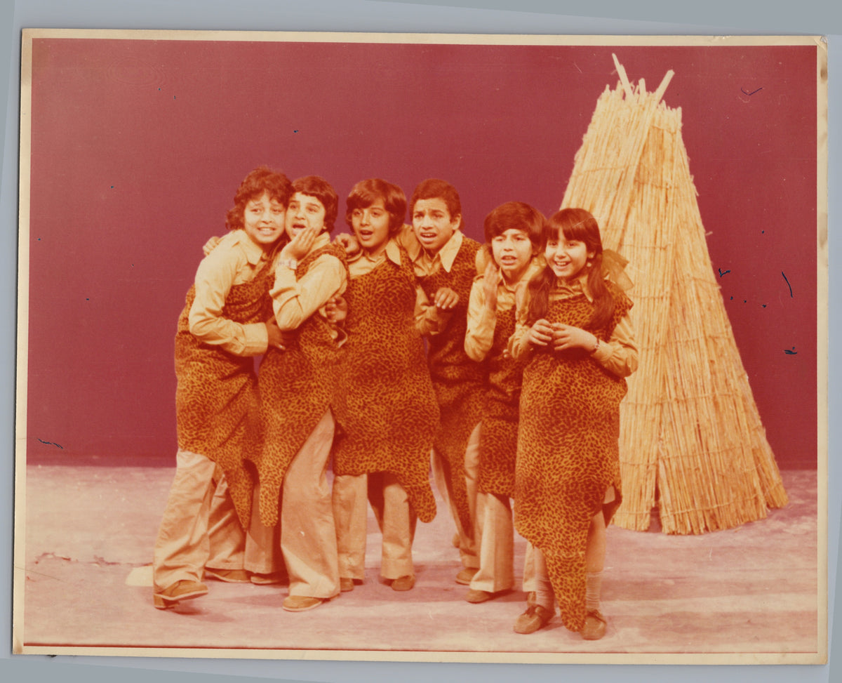 Costumed Performers beside a Straw Stage Prop — front
